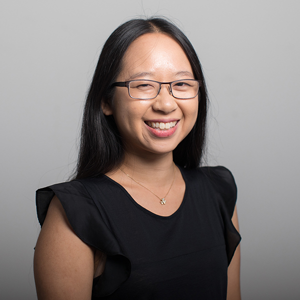 Headshot of Joanna S Kao, an Asian woman wearing glasses and black short-sleeve blouse